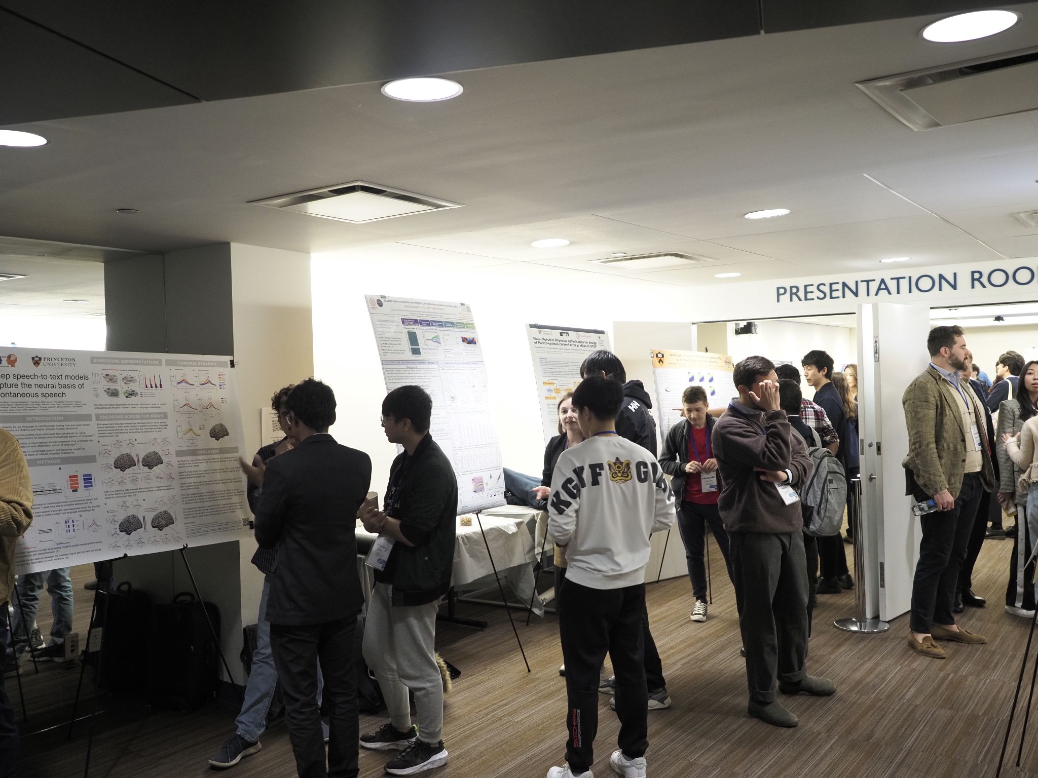 Scientists presenting AI research at conference